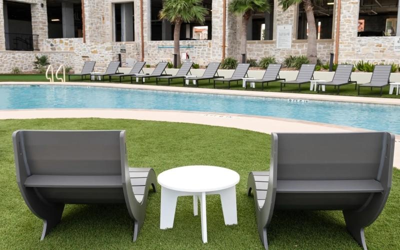 a pool with chairs around it