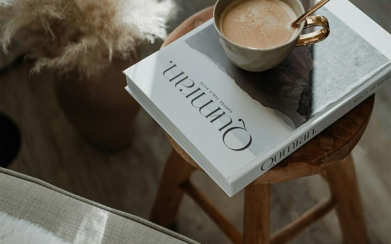 a cup of coffee on a book