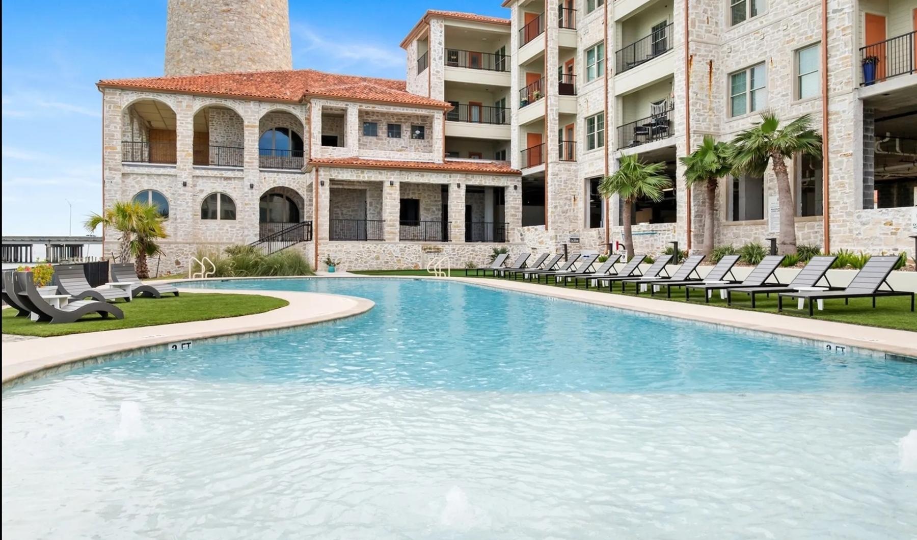 a pool in front of a building