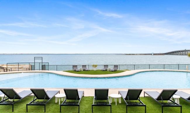 a pool with chairs around it